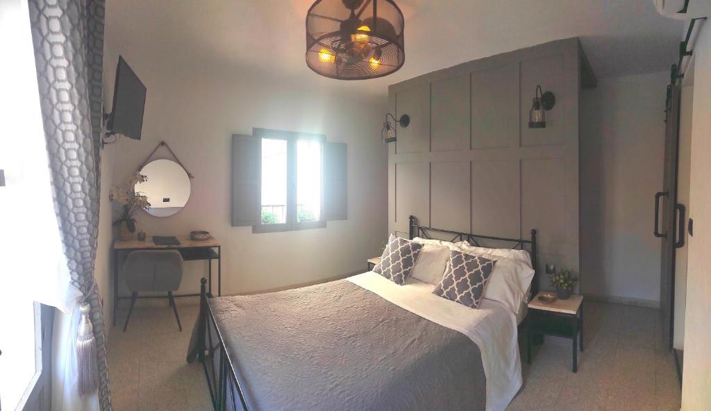 Ένα ή περισσότερα κρεβάτια σε δωμάτιο στο Villa Otivar - Rio Verde