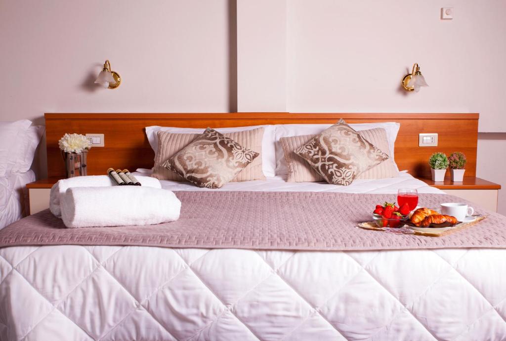 Postel nebo postele na pokoji v ubytování Hotel Ares Milano