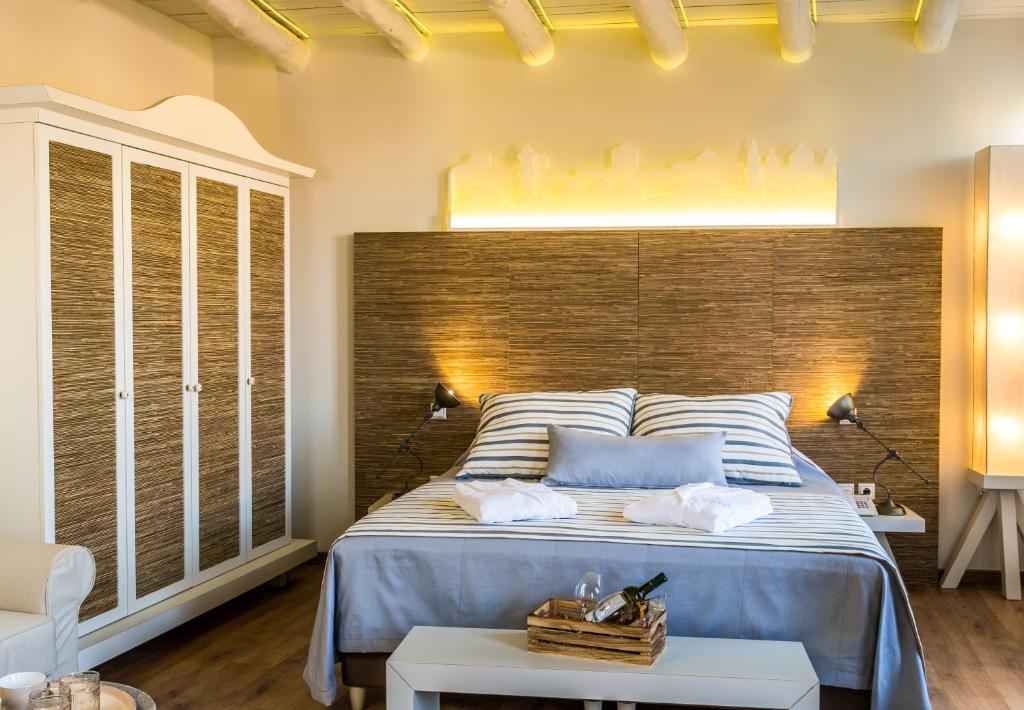 Postel nebo postele na pokoji v ubytování Sette Venti Boutique Hotel