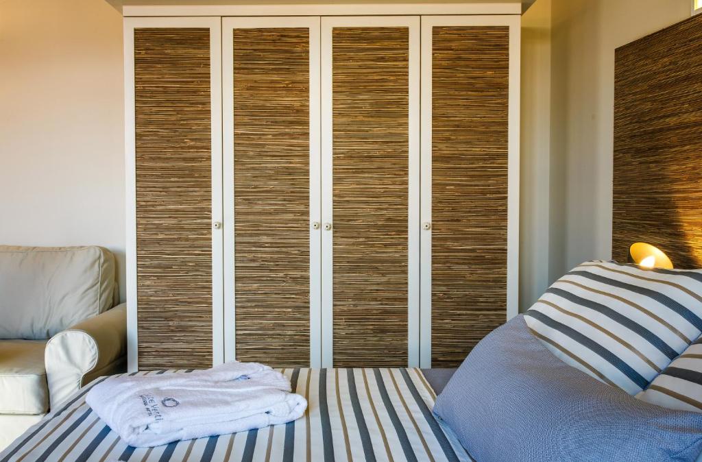 Postel nebo postele na pokoji v ubytování Sette Venti Boutique Hotel