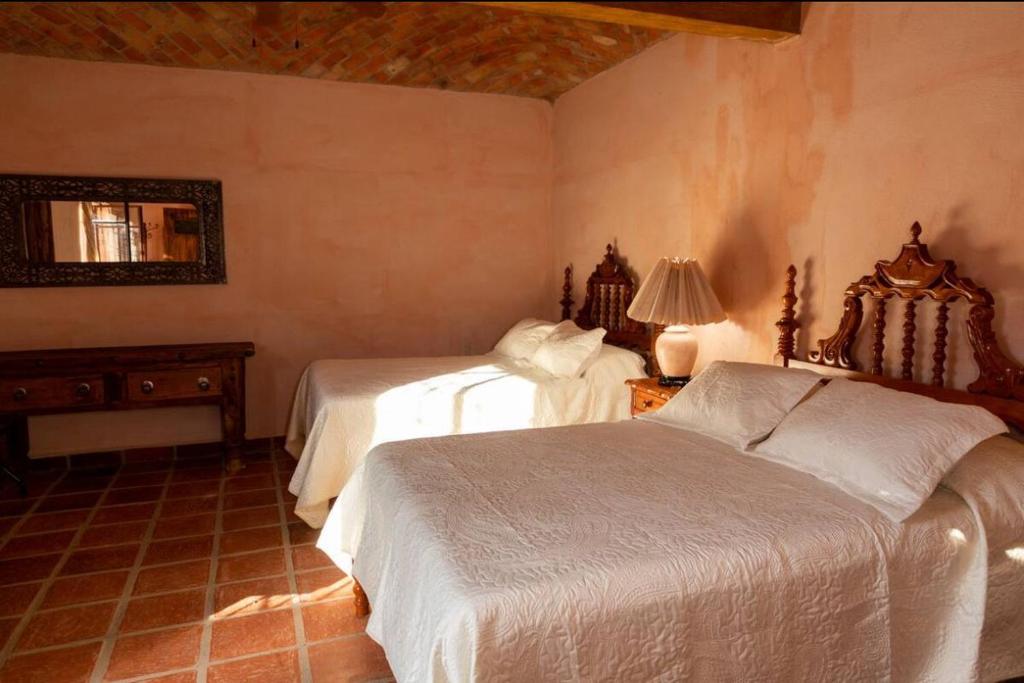 Postel nebo postele na pokoji v ubytování Casa del caballo en hacienda