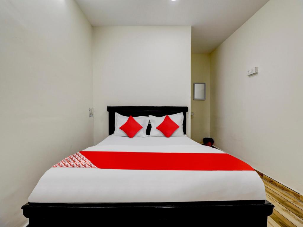 Ένα ή περισσότερα κρεβάτια σε δωμάτιο στο Hotel O SV