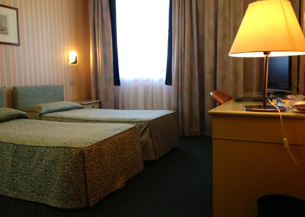 Postel nebo postele na pokoji v ubytování Hotel Daniel