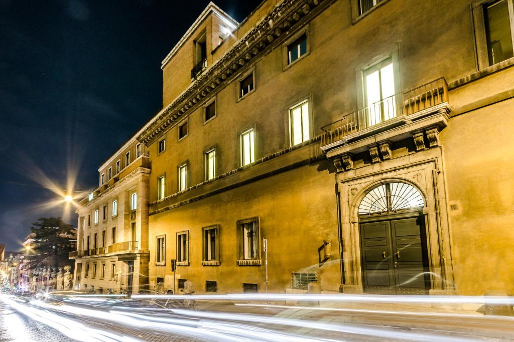 a building with a door on the side of a street at Luxury Rooms H 2000 Roma in Rome