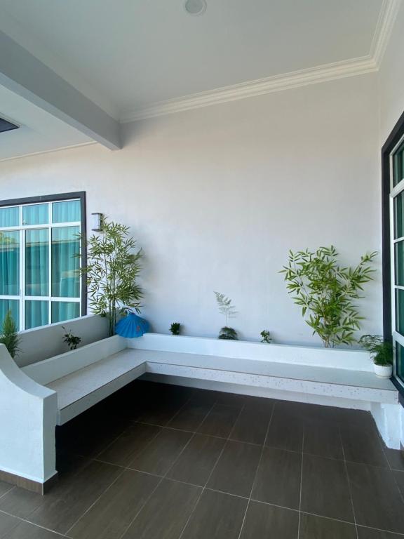Ένα ή περισσότερα κρεβάτια σε δωμάτιο στο Kasa Hana Homestay