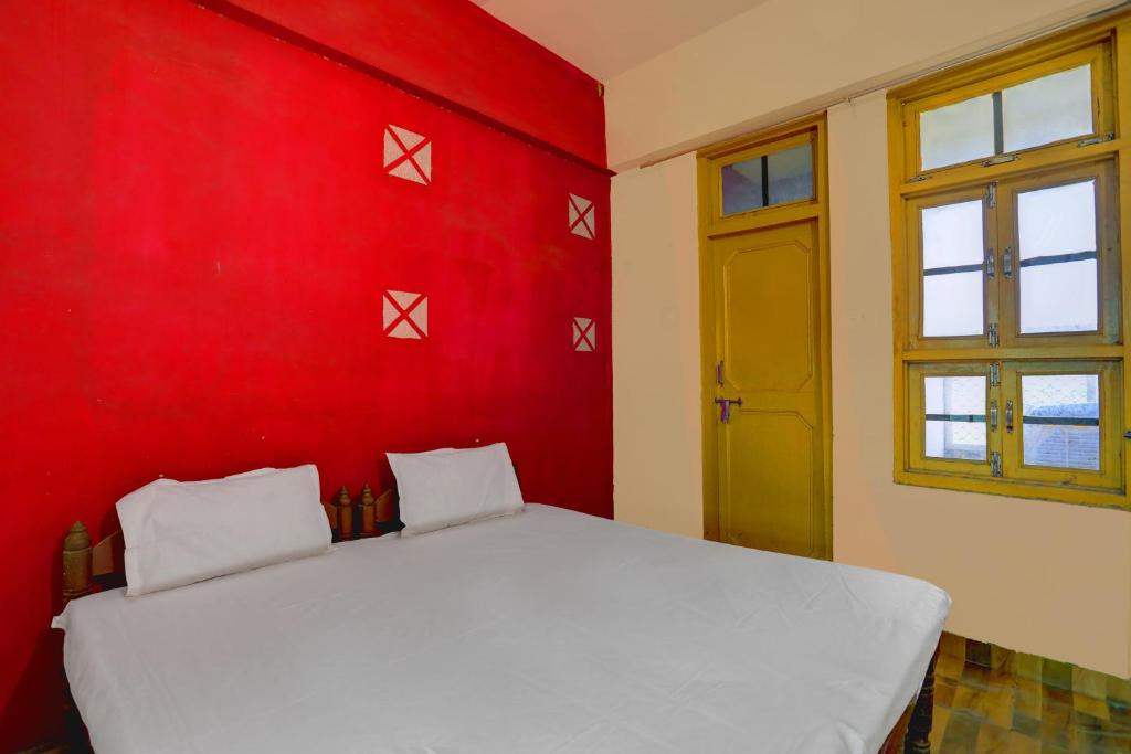 Ένα ή περισσότερα κρεβάτια σε δωμάτιο στο HOTEL O SK GRAND