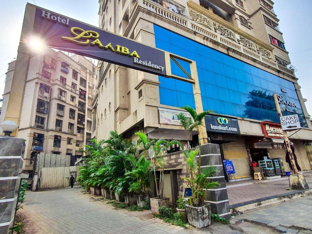 a building with a sign on the side of it at Hotel Laaiba Residency in Mumbai