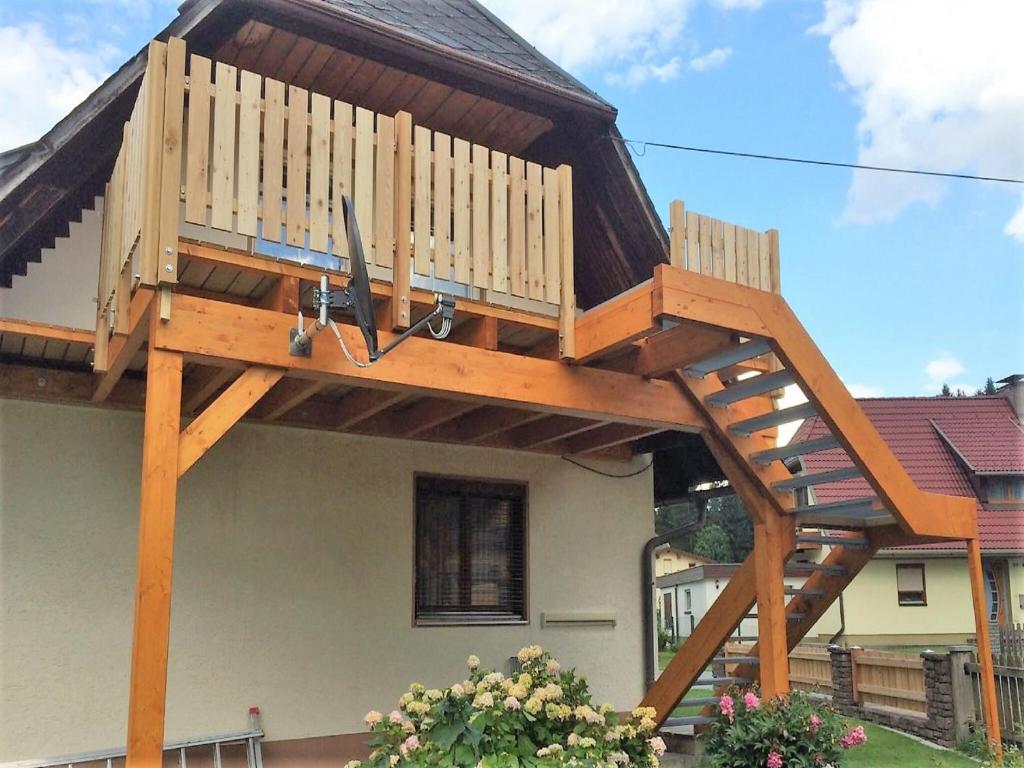 a deck on the side of a house at Apartment in Tröpolach near Nassfeld Gondola in Tröpolach