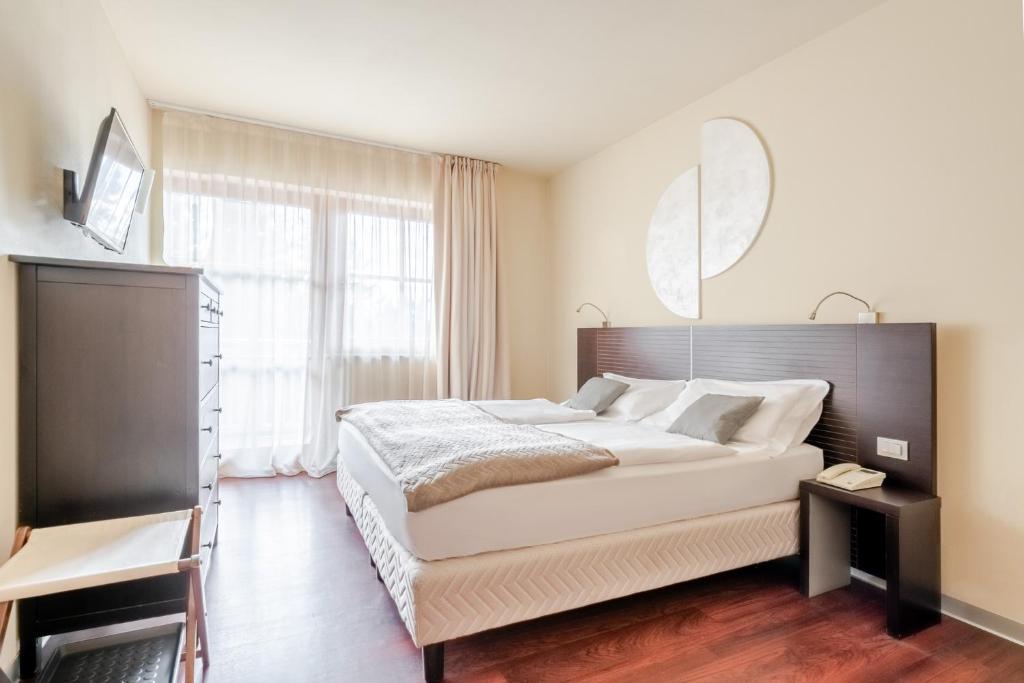 Postel nebo postele na pokoji v ubytování Hotel Norge