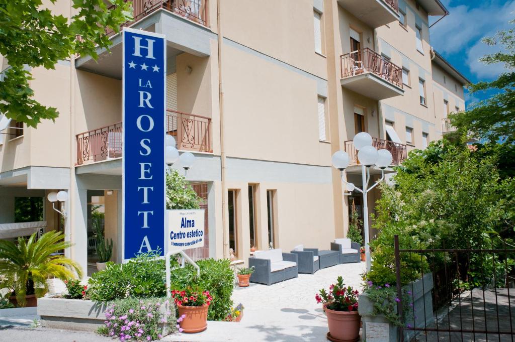 a sign for a hotel in front of a building at Albergo La Rosetta in Chianciano Terme