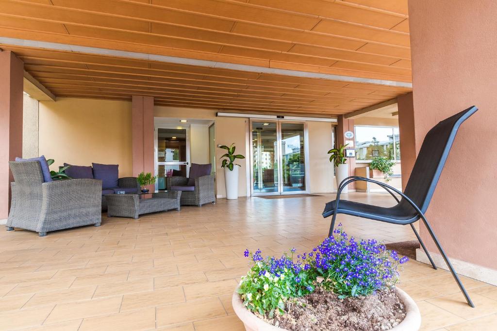 A seating area at Hotel Residence Ulivi E Palme