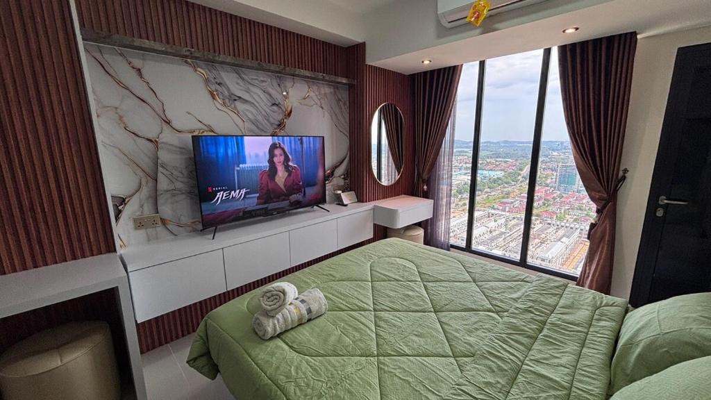 Televisyen dan/atau pusat hiburan di Pollux Habibi Service Apartment