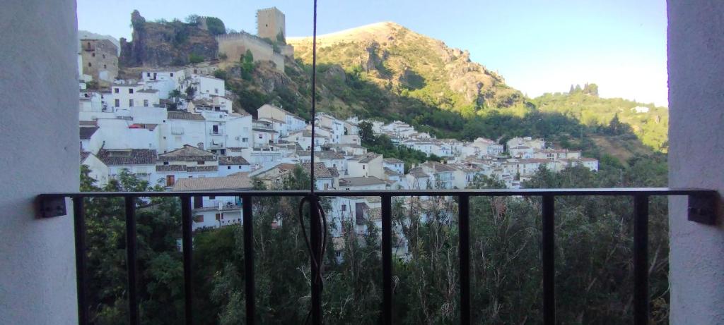 a view from a balcony of a town with a mountain at Casa abuelo Kalinas in Cazorla