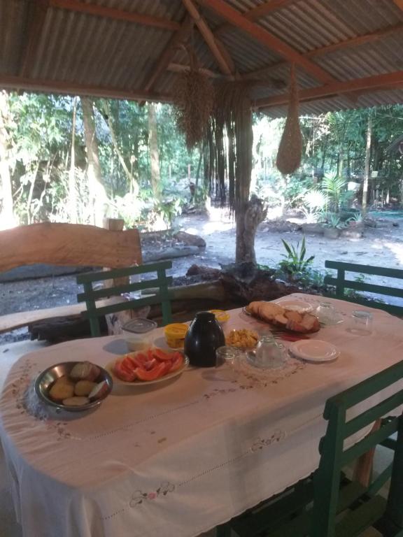 a table with food on top of it at Casa da Ilha Cotijuba in Belém