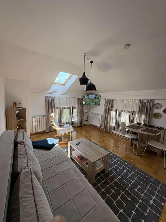 a living room with a couch and a table at Mills Apartment, Baščaršija-Stari Grad in Sarajevo