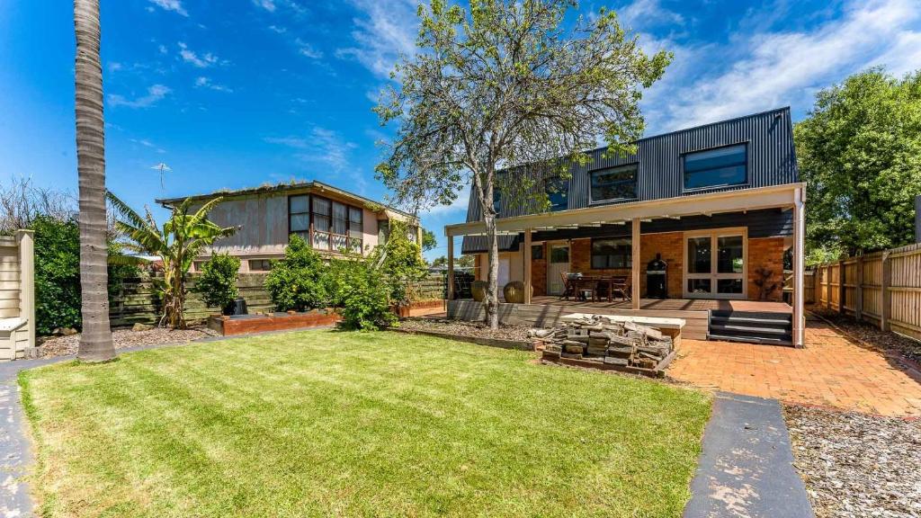 a house with a large yard in front of it at Carlton Place in Cowes