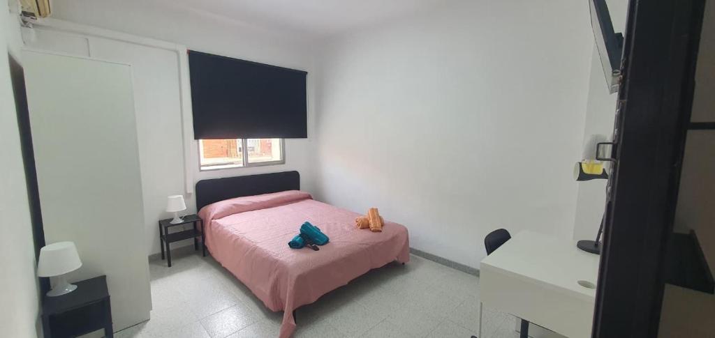 Postel nebo postele na pokoji v ubytování Habitaciones Céntricas en Vivienda Compartida