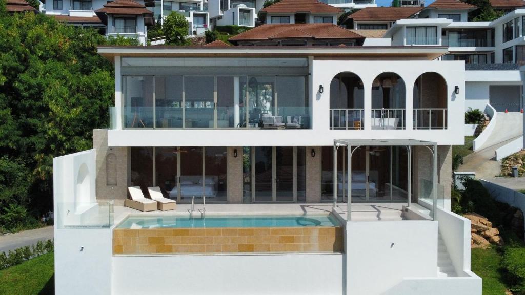 an aerial view of a house with a swimming pool at villaSAMU in Amphoe Koh Samui