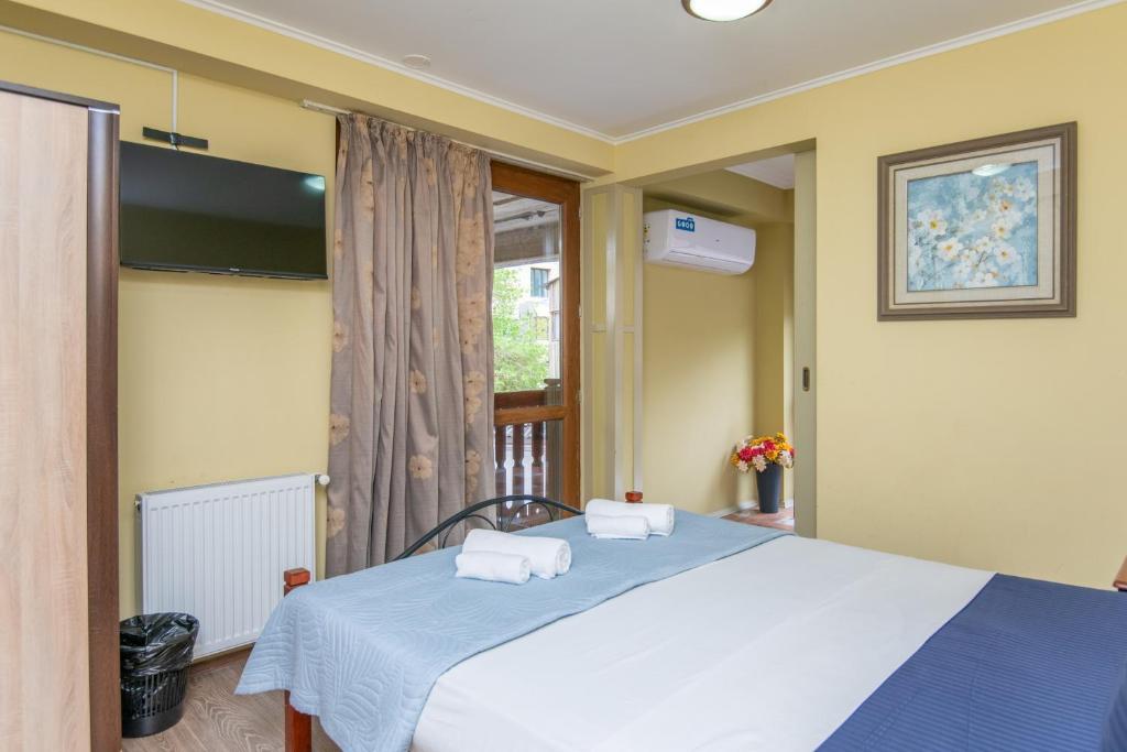 Postel nebo postele na pokoji v ubytování Aura Plaza Hotel