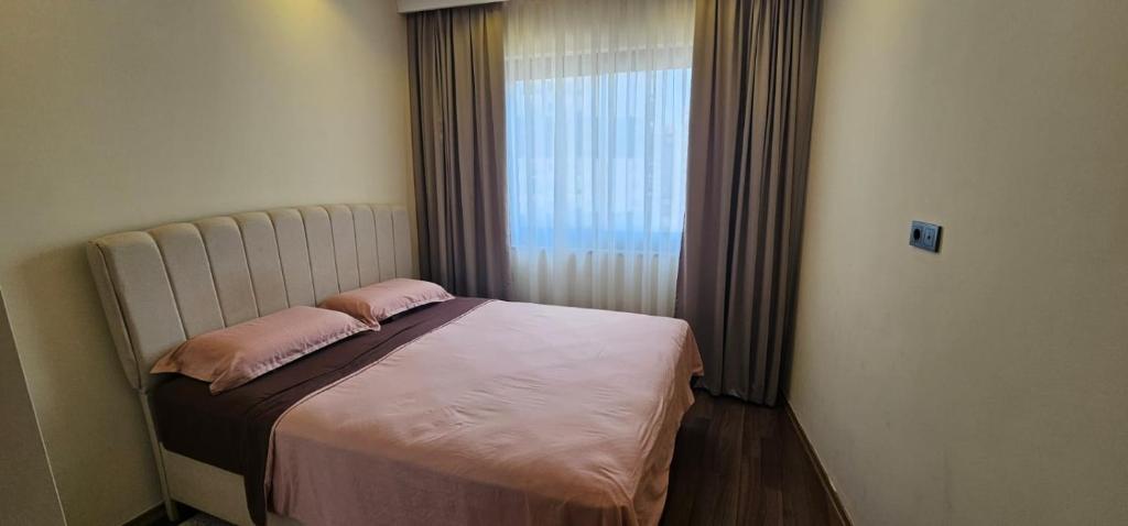 Ένα ή περισσότερα κρεβάτια σε δωμάτιο στο Serenity residence best