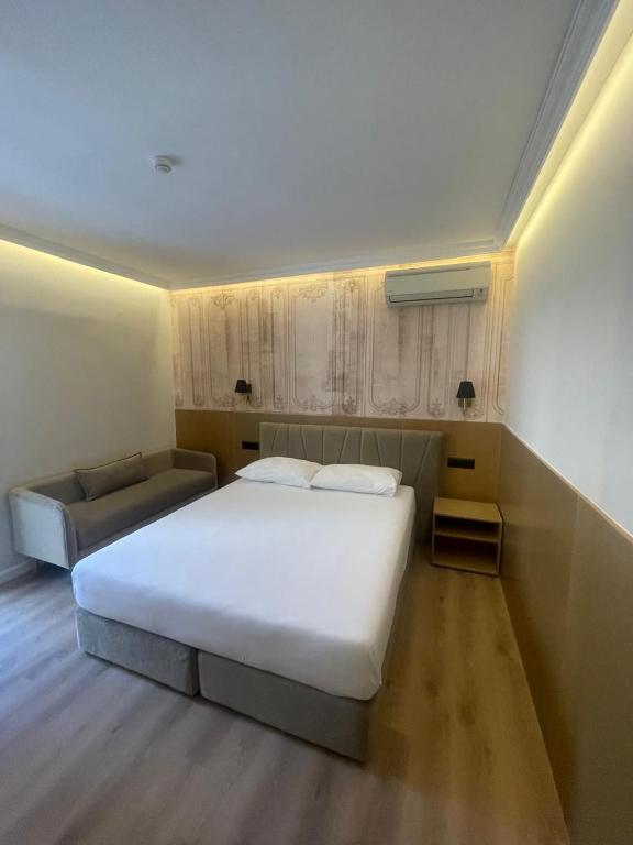 Llit o llits en una habitació de Hotel Piemonte