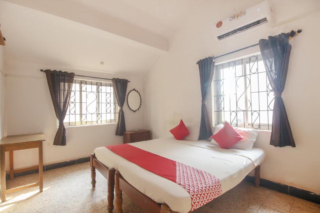 Postel nebo postele na pokoji v ubytování Hotel O Delma's guest house