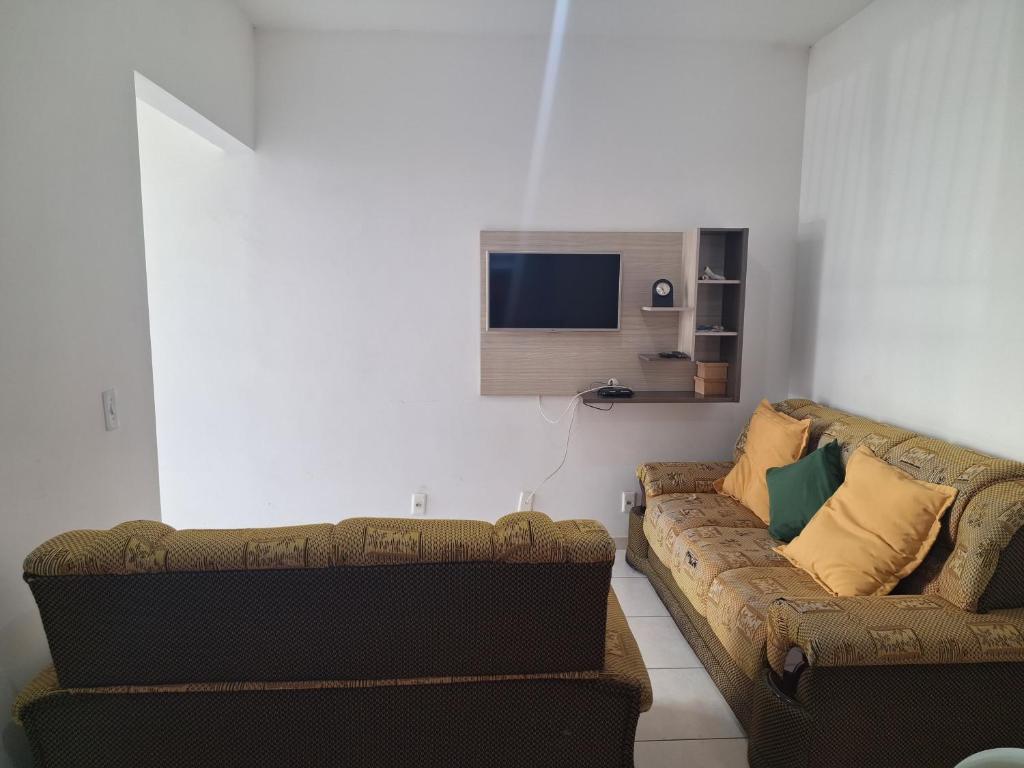 TV a/nebo společenská místnost v ubytování Apartamento Charmoso no térreo