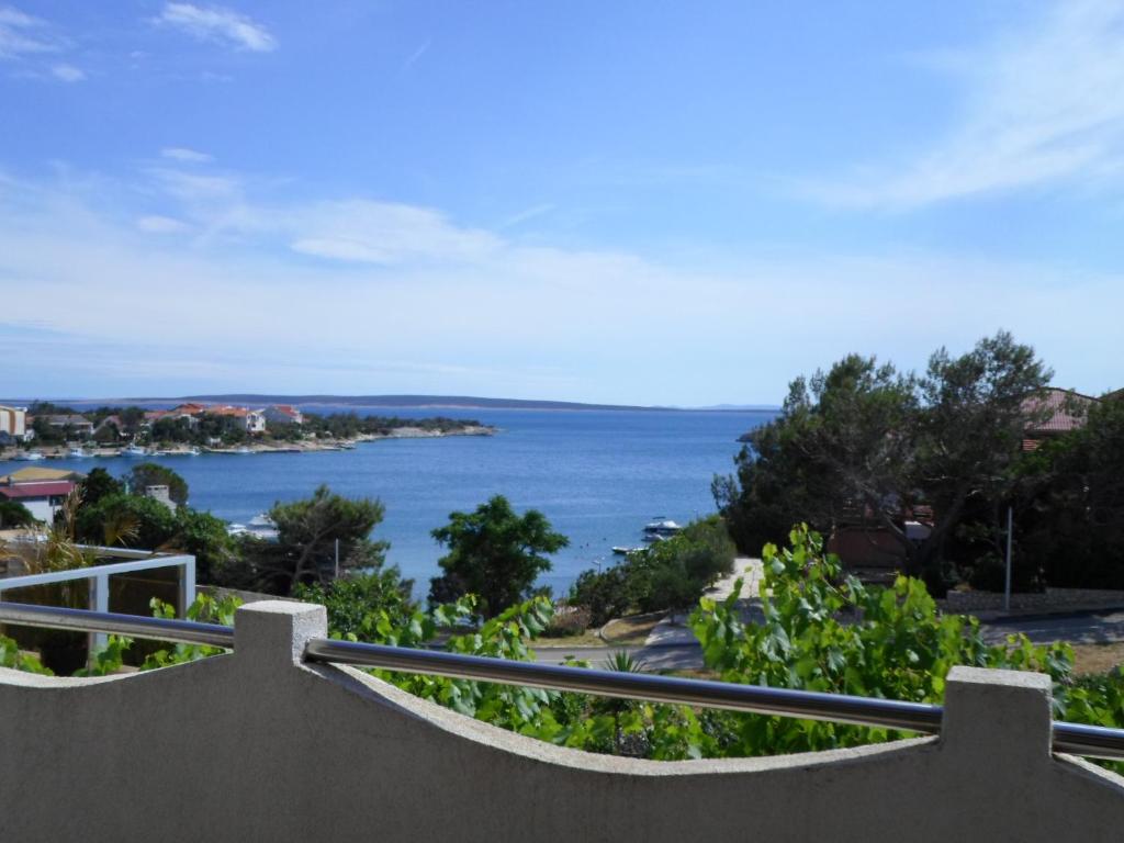 a view of the ocean from a balcony at Apartments Antica in Šimuni
