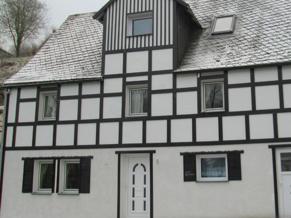 an old house with black and white at Gruppenferienhaus im Sauerland in Schmallenberg