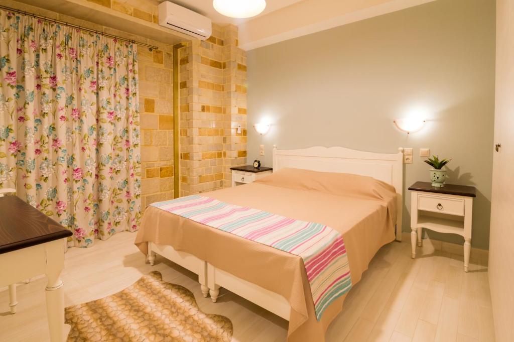 Posteľ alebo postele v izbe v ubytovaní Nikolas country villa-anesis family