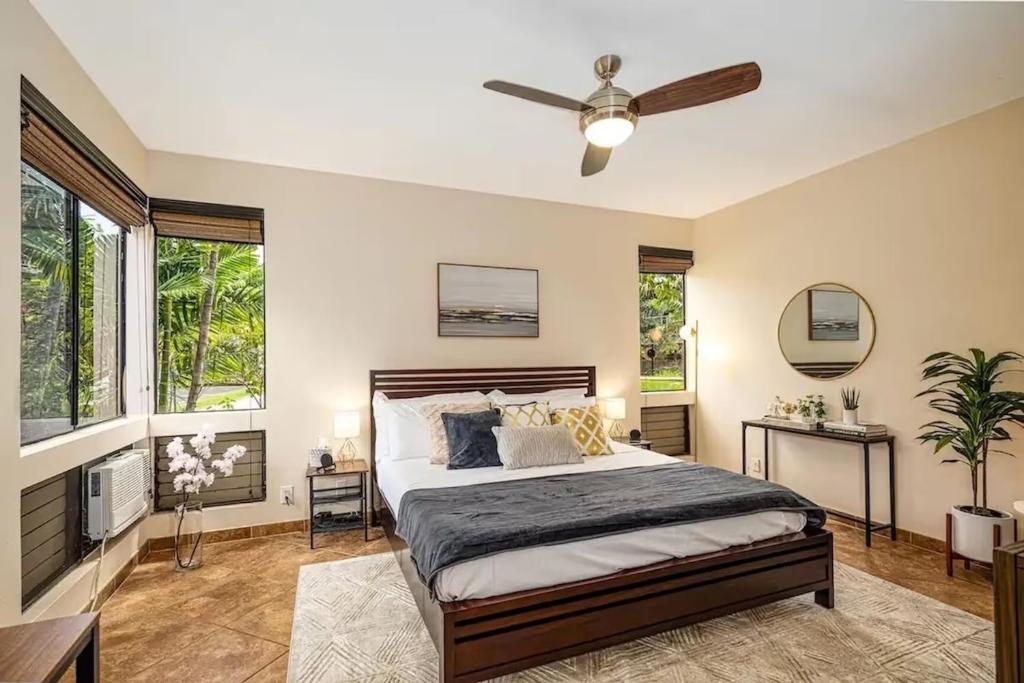 a bedroom with a bed and a ceiling fan at Premier Collection at Grand Champions Wailea - Limited-Time Half Off in Wailea