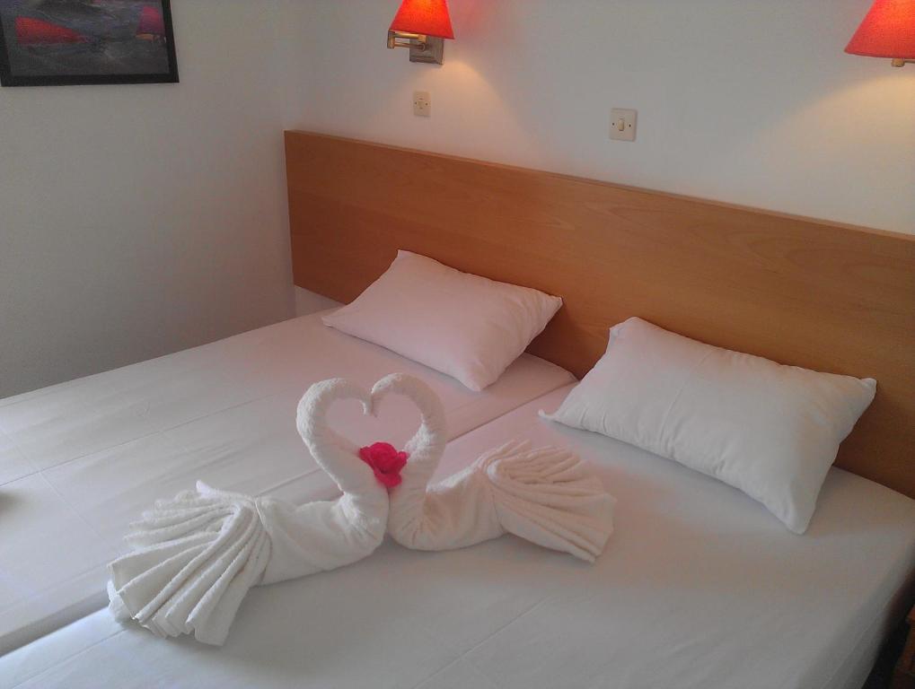 Postel nebo postele na pokoji v ubytování Amfi Apartments