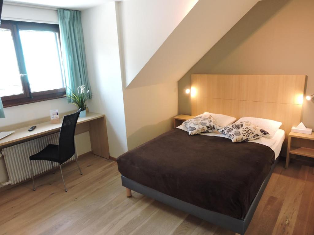 Postel nebo postele na pokoji v ubytování Auberge Communale de St-Légier