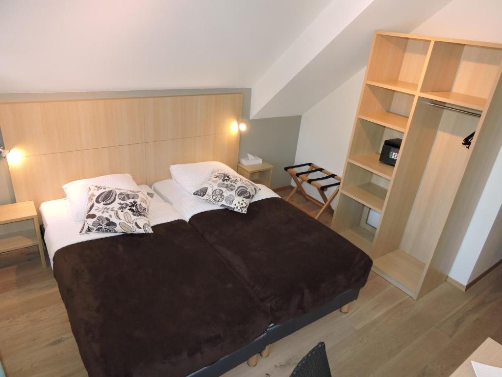 Postel nebo postele na pokoji v ubytování Auberge Communale de St-Légier