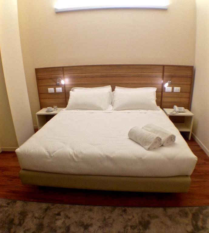 Postel nebo postele na pokoji v ubytování Hotel Forum