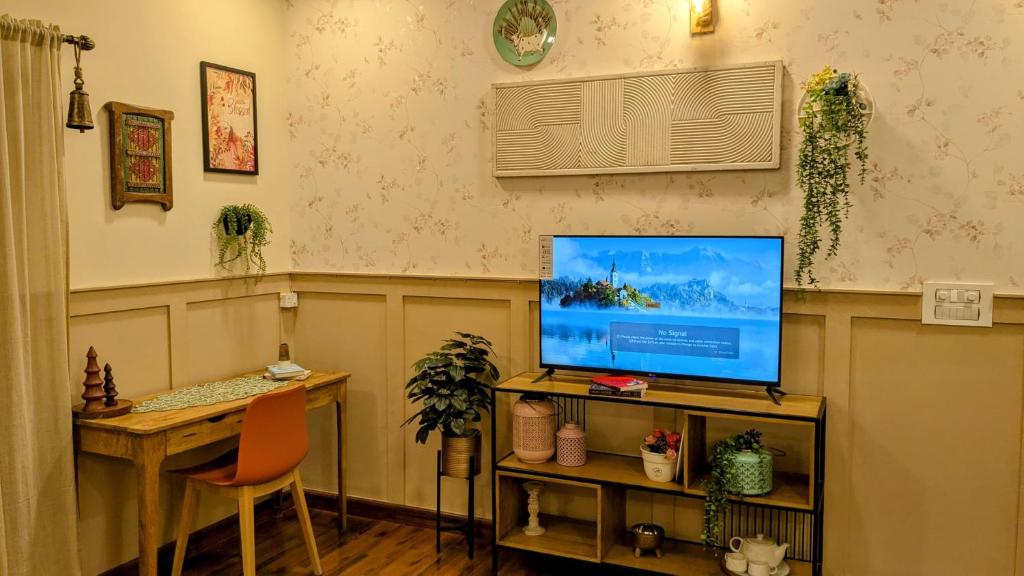 TV a/nebo společenská místnost v ubytování Charming Nook & Breakfast Treat