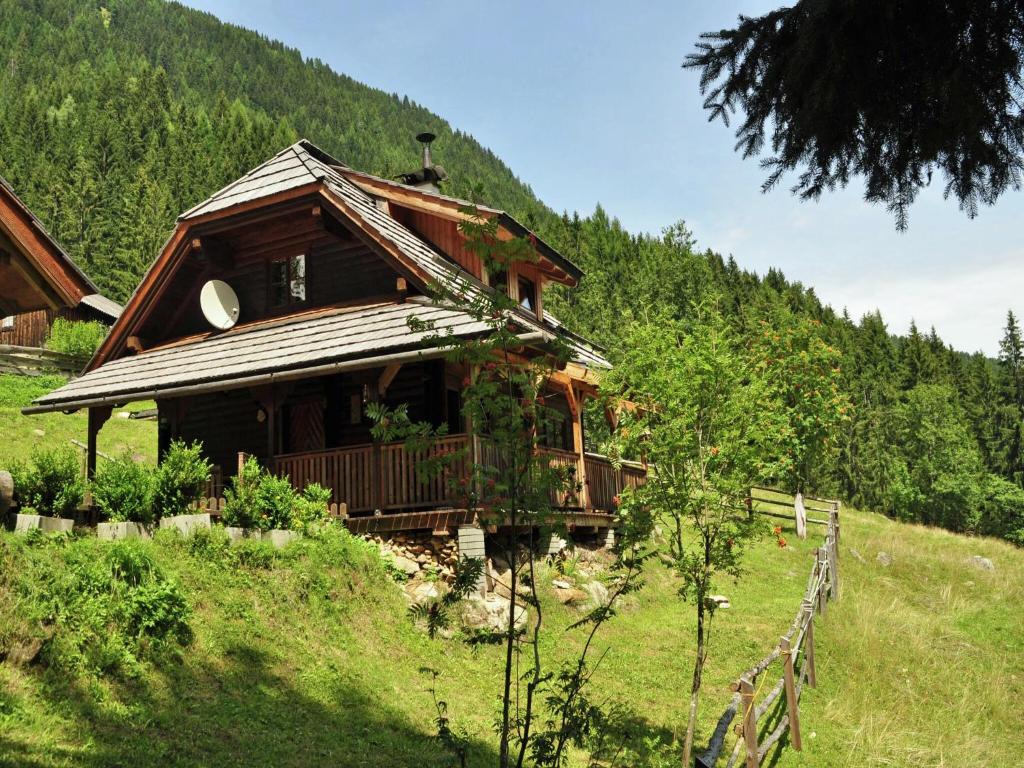 a small house on a hill in a field at Chalet in Kolbnitz near Ski Slopes in Penk