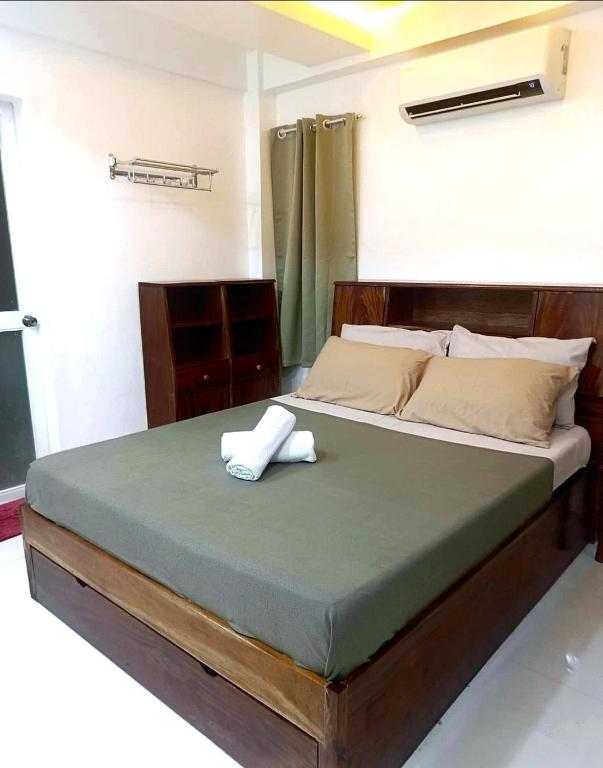 Ένα ή περισσότερα κρεβάτια σε δωμάτιο στο Panikseafarm Couple Room in a Homestay at San Juan La Union - Panikseafarm