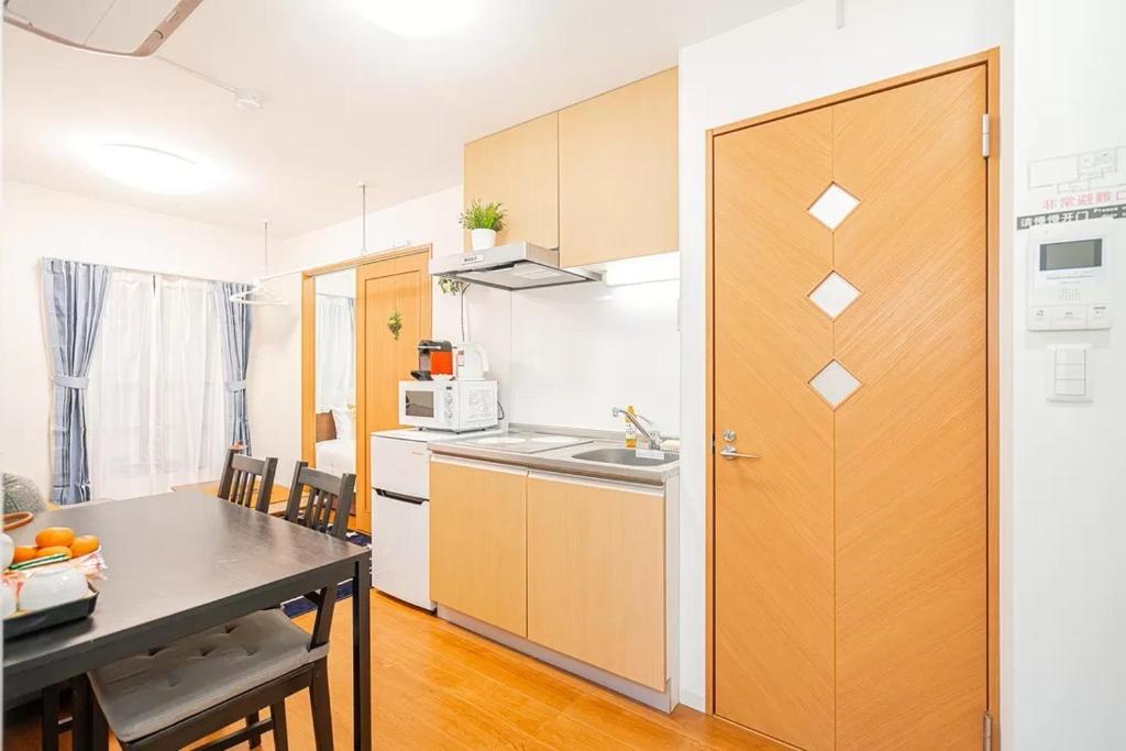 Kuchyň nebo kuchyňský kout v ubytování Akihabara Skytree Premium Apartment 301
