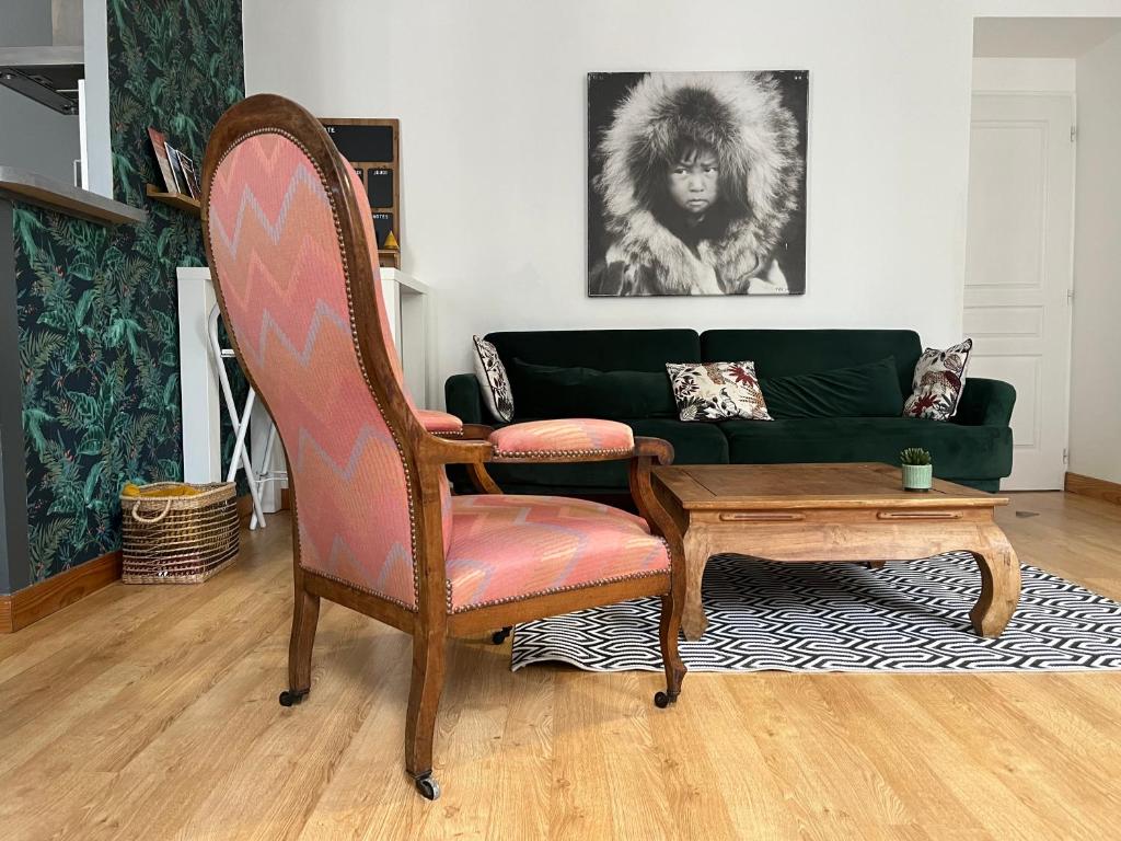 a living room with a couch and a chair at LE BERCHON classé trois ETOILES in Nay