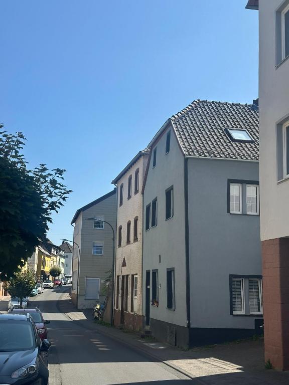 a row of buildings on a street with cars parked at Ferienwohnung Louis in Gerolstein