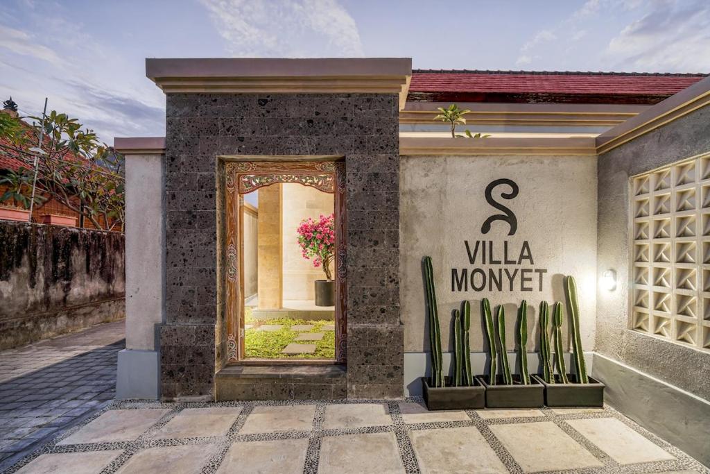 a entrance to a villa with a sign that reads s villa money at Stunning 2 bed Beachside Villa Brand New in Sanur