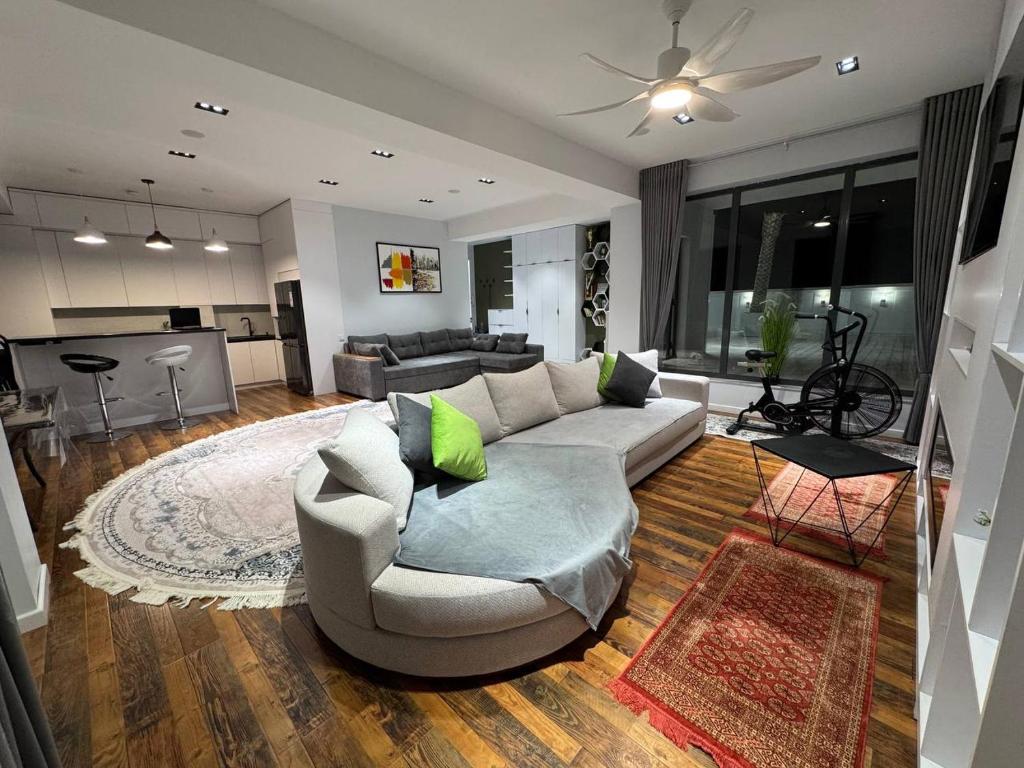 a living room with a couch and a table at Bukhara Penthouse in Bukhara