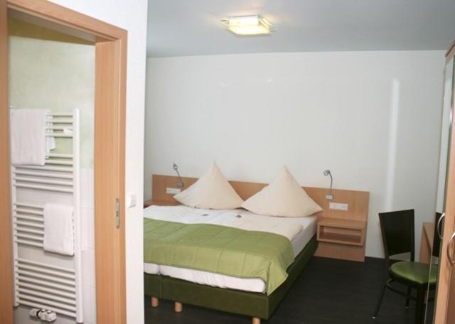 Postel nebo postele na pokoji v ubytování Ringhotel Alfsee Piazza