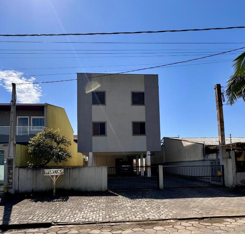a building with a cross on the side of it at Apê Brisa do Mar in Pontal do Paraná