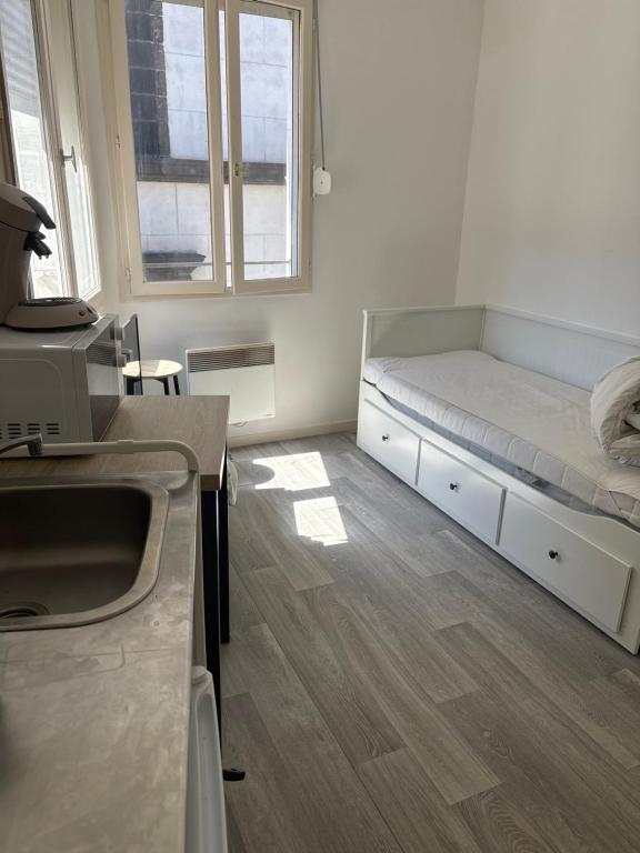 Postel nebo postele na pokoji v ubytování Studio Lumineux Place de Jaude