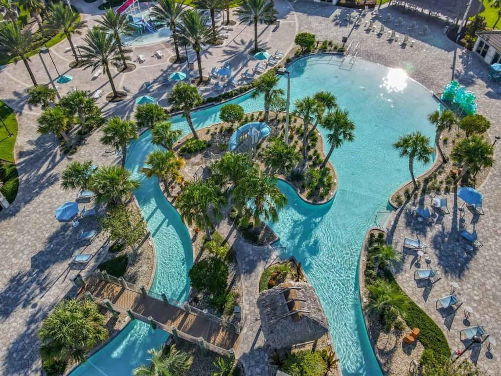 an overhead view of a pool at a resort at Disney Magic ChampionsGate Resort House 15 min from Disney World, with Club House, 7 Pools and Water Park in Kissimmee