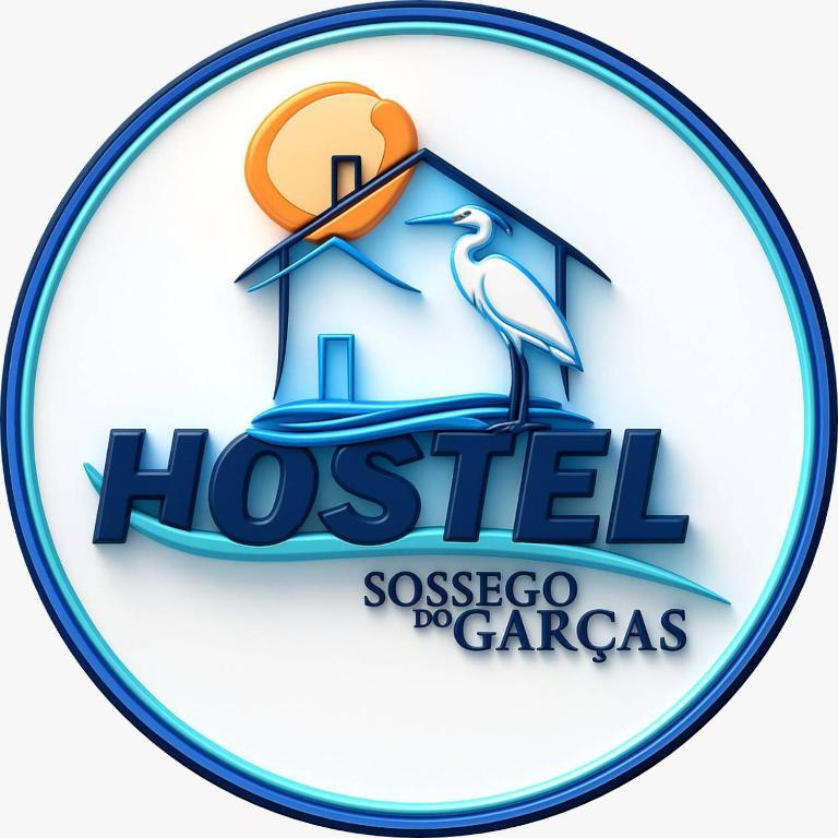 a logo of a house with a bird in it at Hostel Sossego do Garças in Barra do Garças