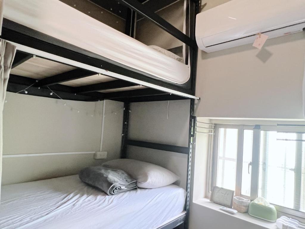 Postel nebo postele na pokoji v ubytování Chengguang B&B