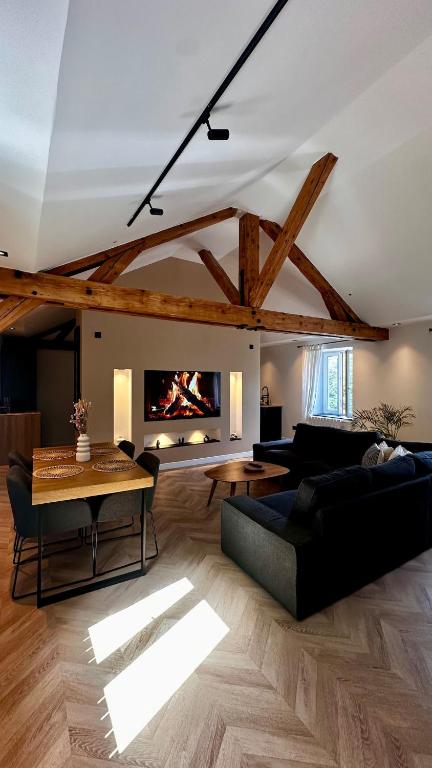 a living room with a couch and a table at Magnifique appartement centre ville de Besançon in Besançon
